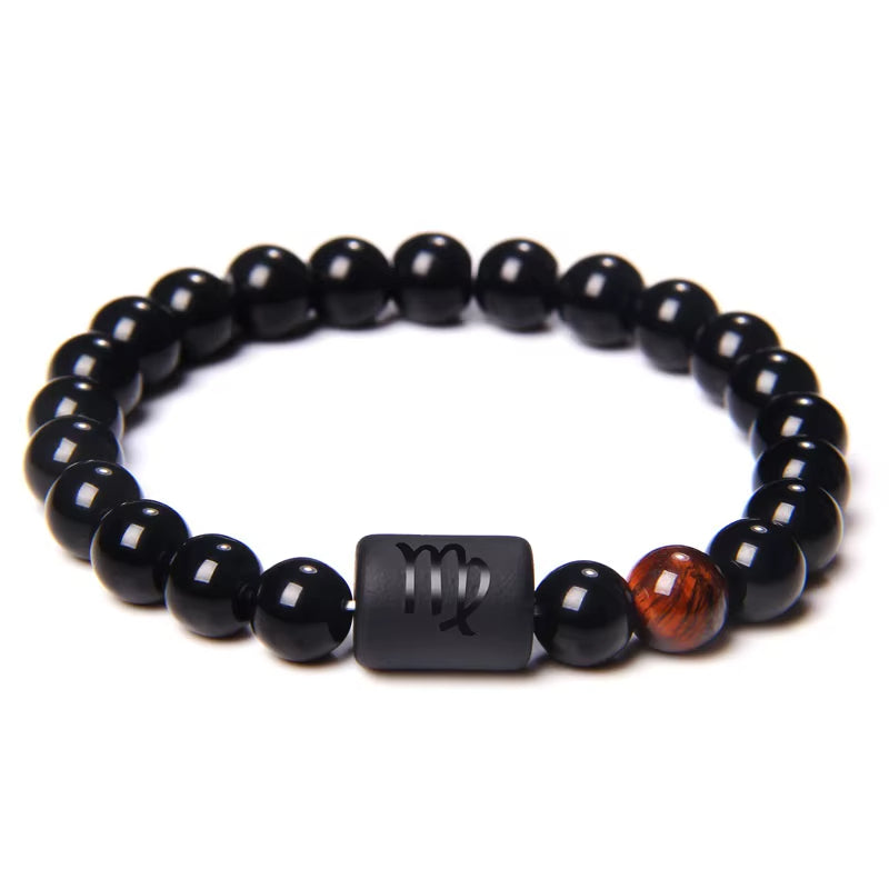 Bracelet Signe Astrologique Perles d’Onyx sur fond blanc