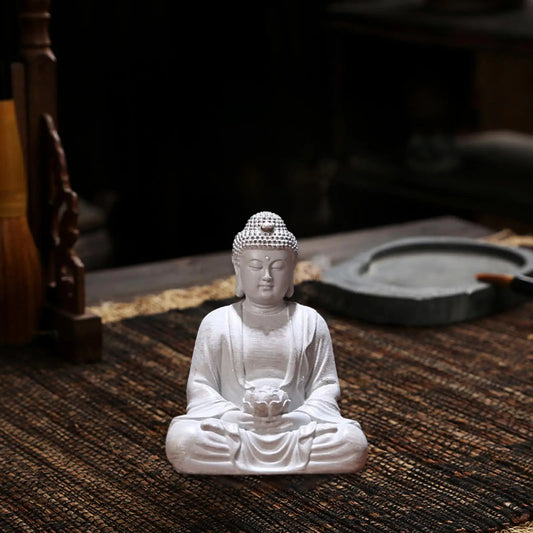 Statuette Bouddha de style antique en résine sur fond marron