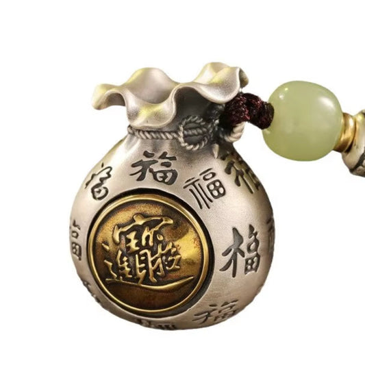 Pendentif Bourse Porte Bonheur sur fond blanc