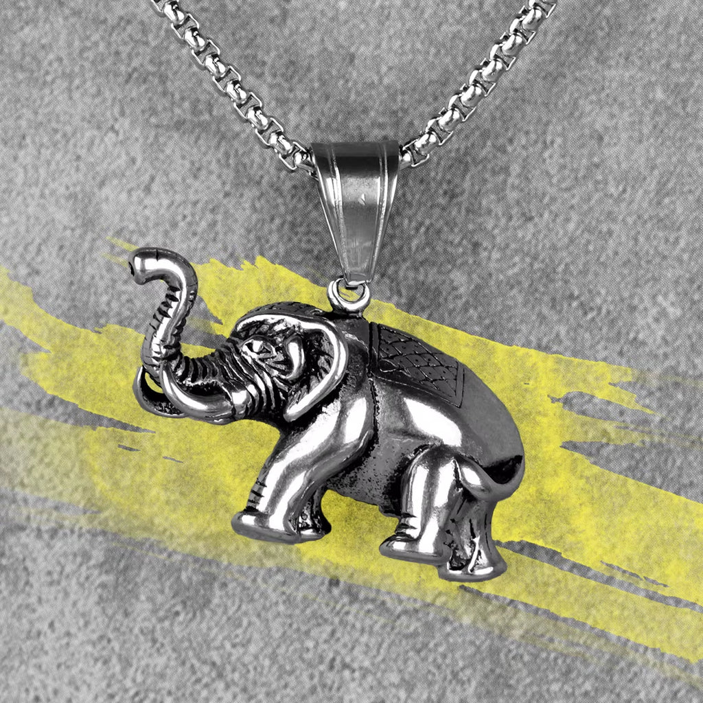 Pendentif Elephant en Acier Inoxydable sur fond gris et jaune
