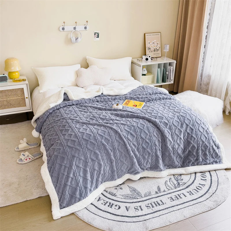 un grand plaid posé sur un lit