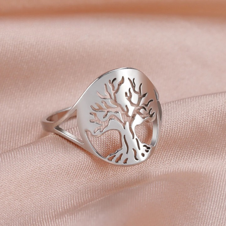 Bague arbre de vie en acier inoxydable sur fond rose