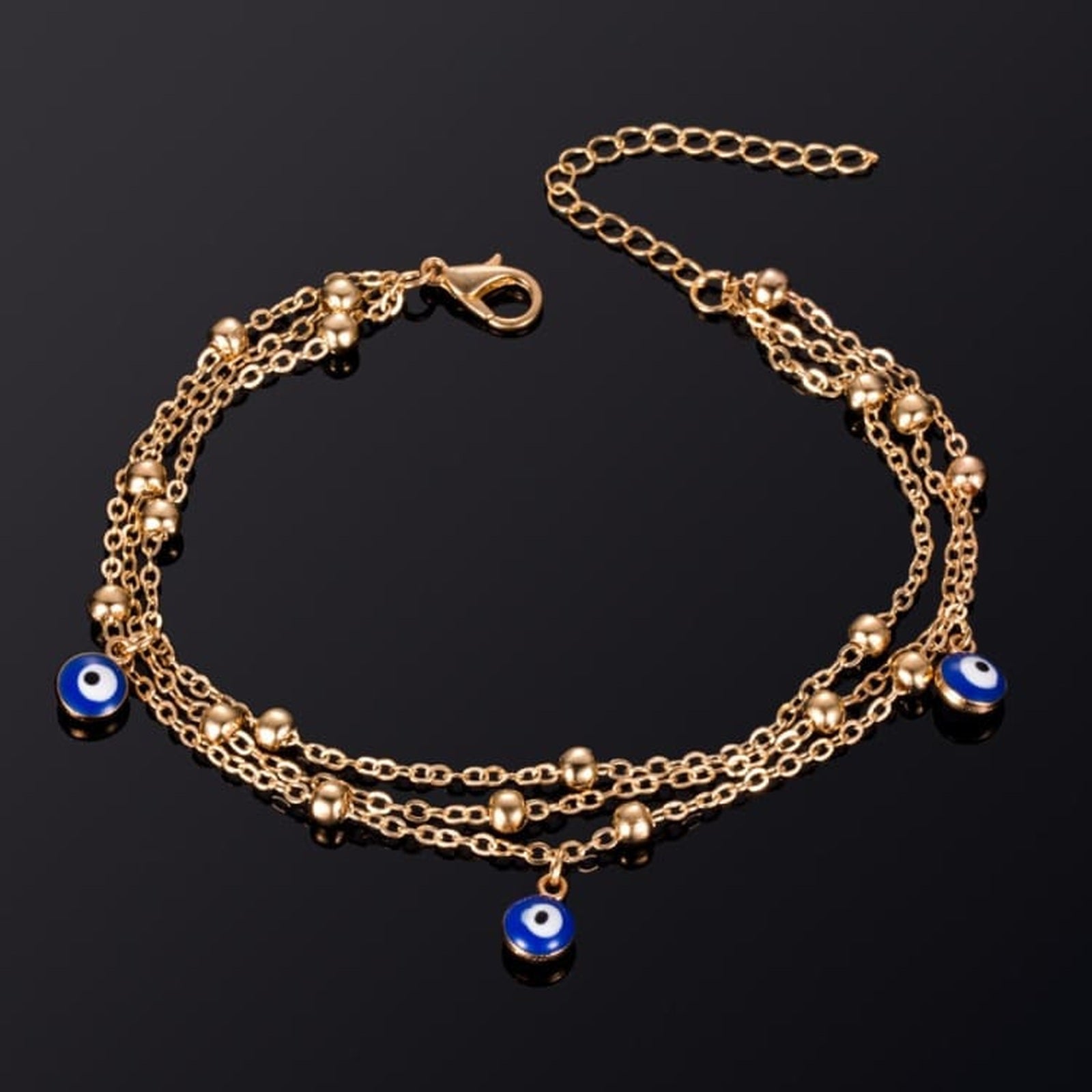 Bracelet de cheville Nazar Boncuk Or à trois yeux bleus Image