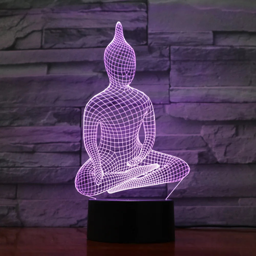 Lampe zen bouddha à couleur variable sur une table sur fond gris de pierres