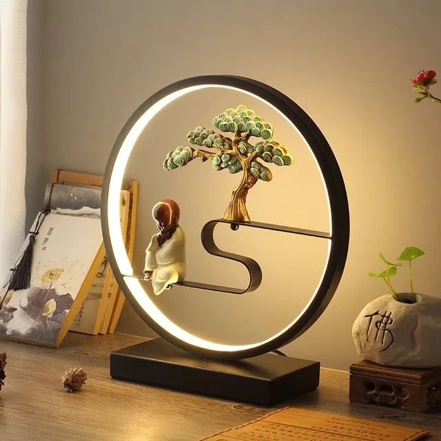 Lampe zen ronde avec bouddha et un arbre en aluminium