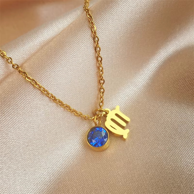 Pendentif Signe Astrologique avec Zircon sur fond beige