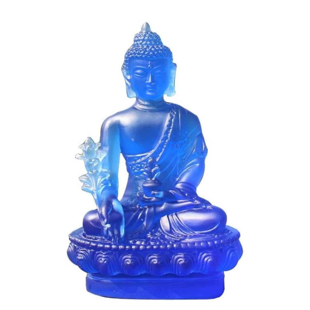 Statuette de Bouddha bleue sur socle lotus et fond blanc