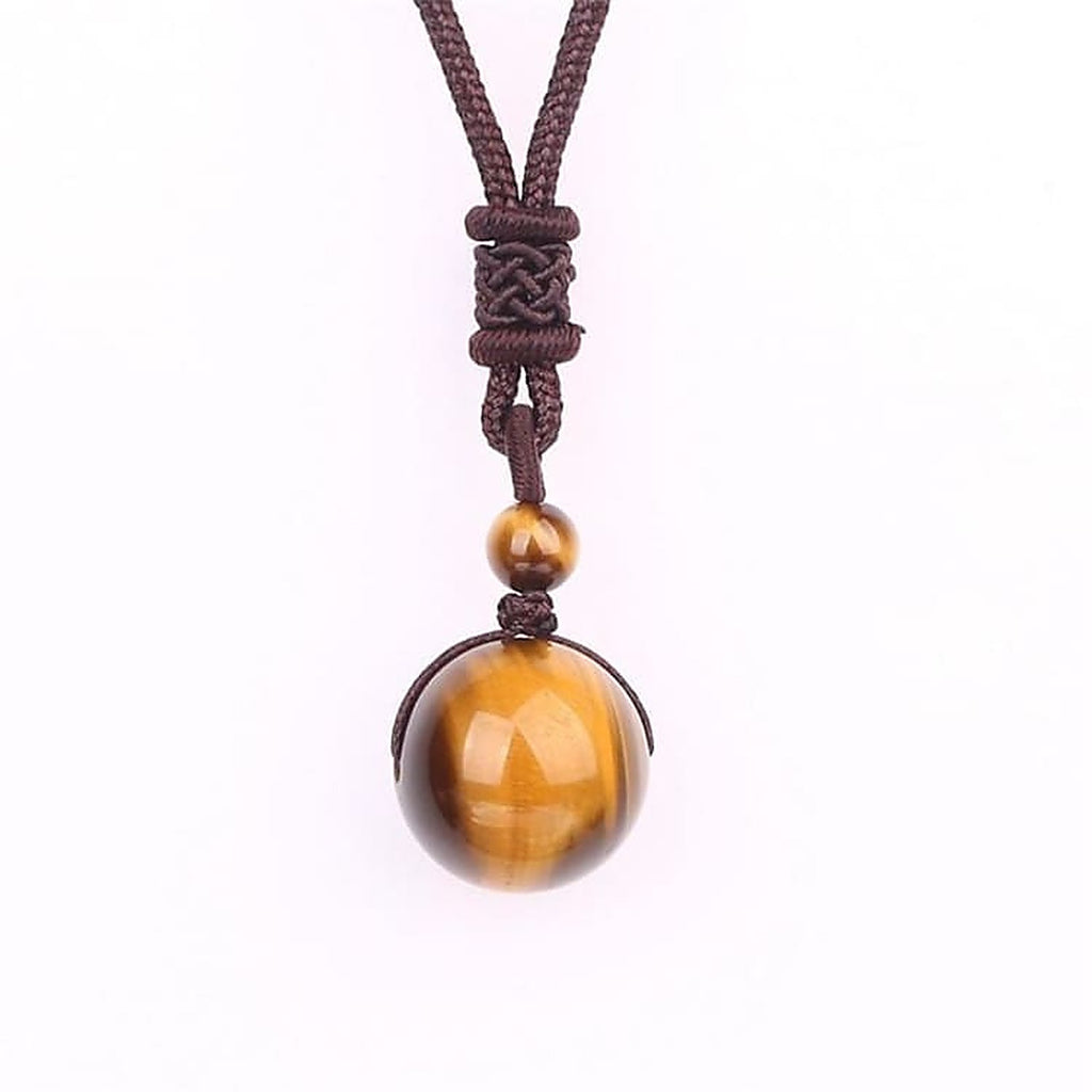 Collier pendentif boule en oeil de tigre, cordon tressé brun et noeud décoratif