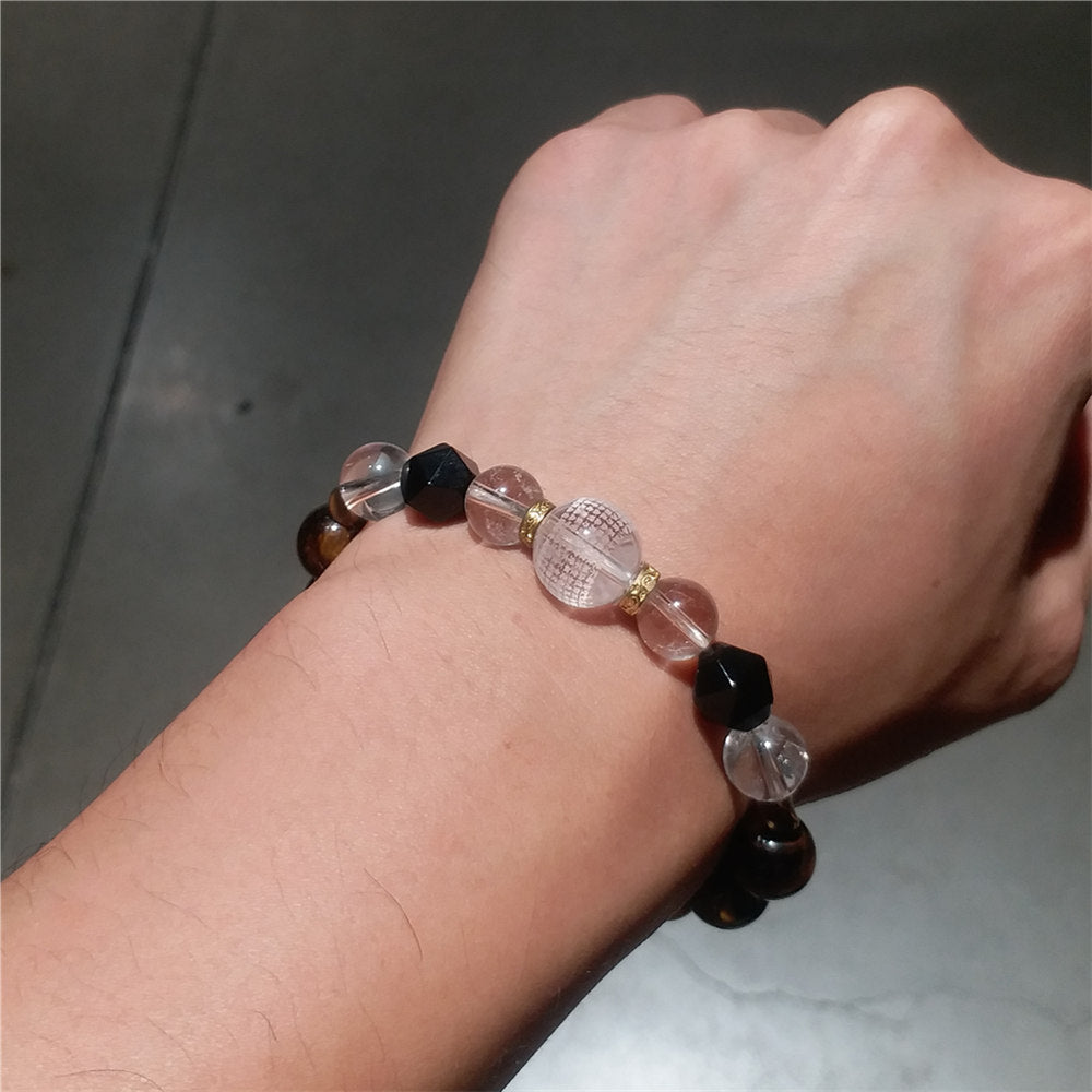 Bracelet œil de tigre avec boule en cristal gravé