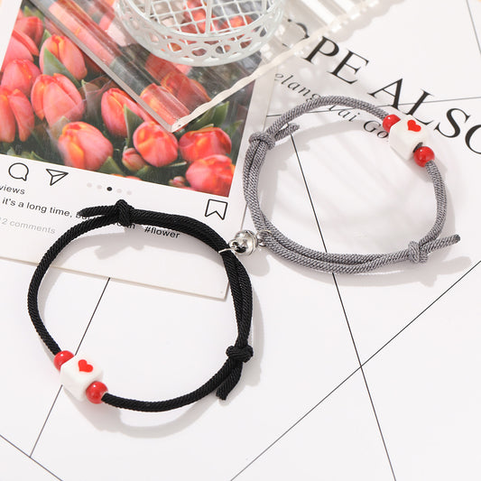 Bracelet de couple avec perles et coeur rouge