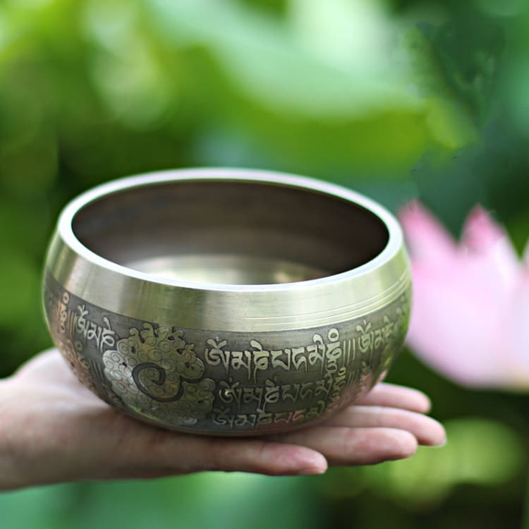Bol tibétain en son de bouddha sculpté à la main du Népal