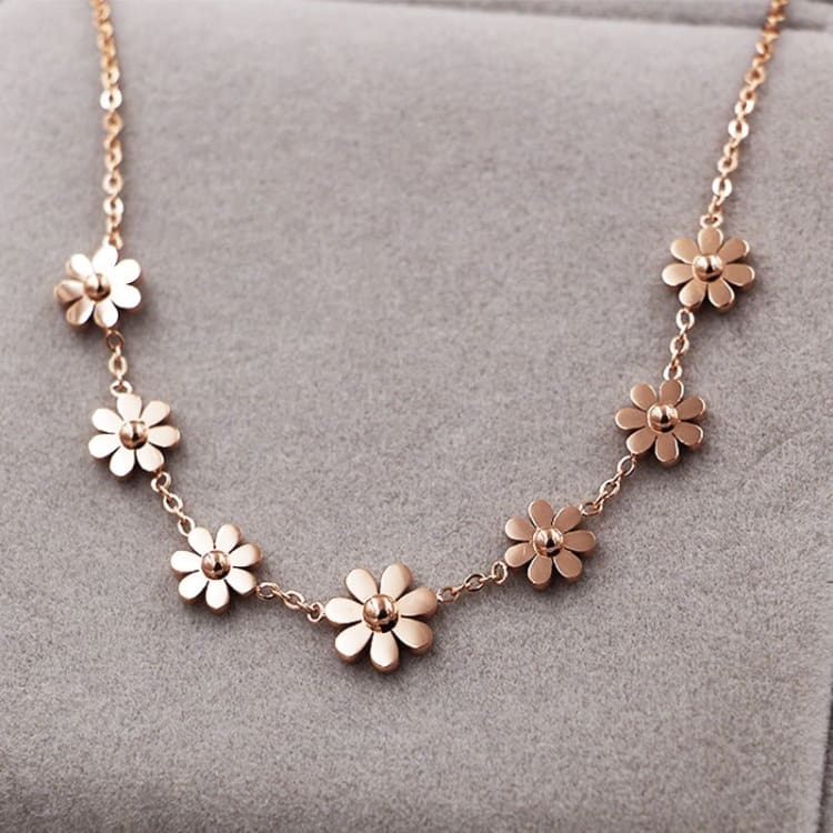 Bracelet de cheville marguerite or rose, sept fleurs sur velours gris Image
